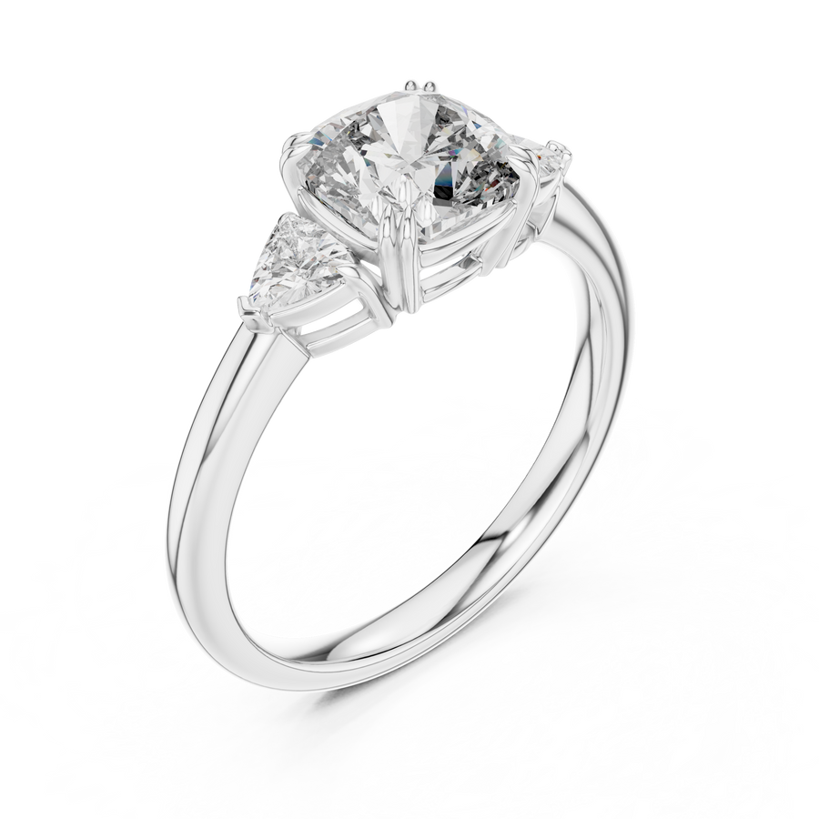 White gold lab grown diamond cushion cut three stone engagement ring, angled view
