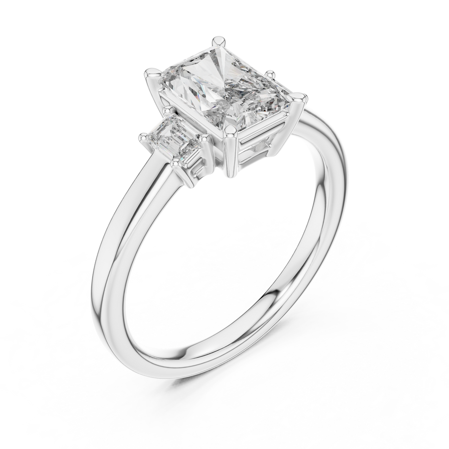 White gold lab grown diamond radiant cut three stone engagement ring, angled view
