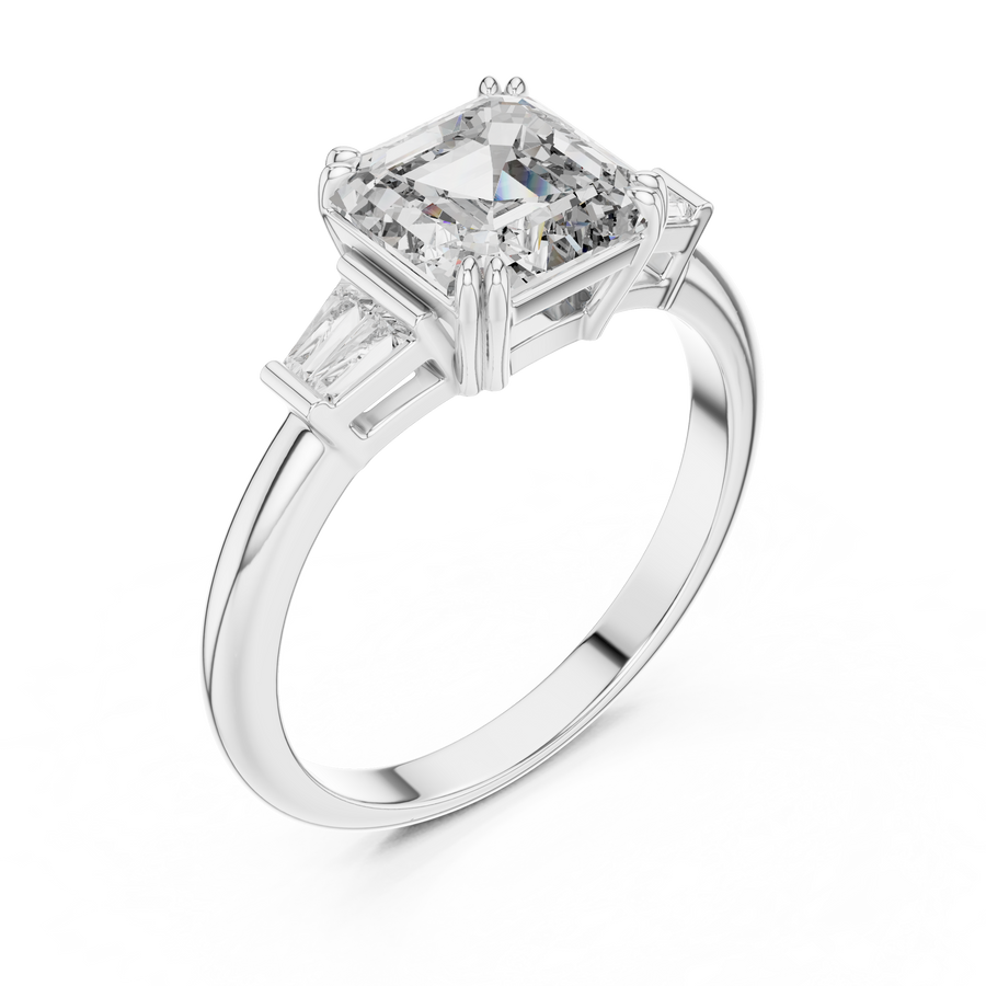 Emerald cut lab grown diamond three stone ring with baguette side stones in white gold, front view