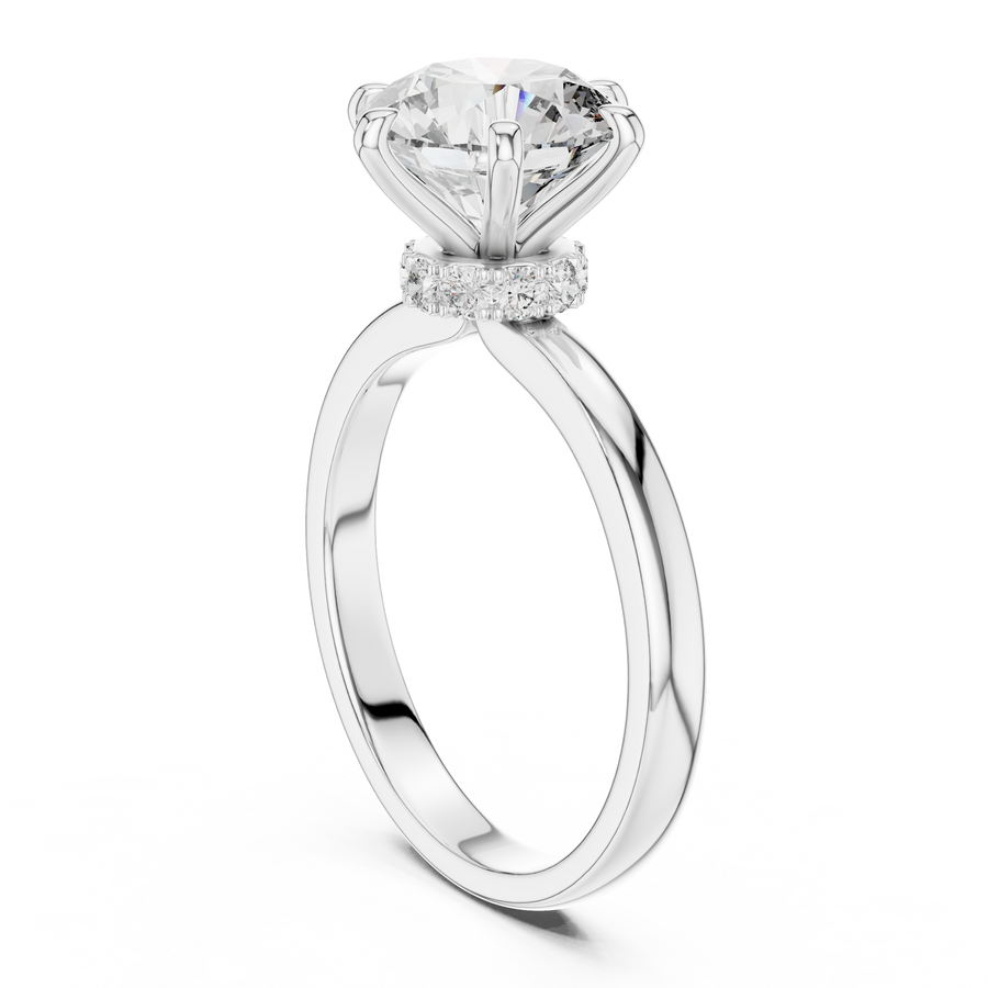 White gold round solitaire lab-grown diamond engagement ring with six-prong setting and hidden halo.