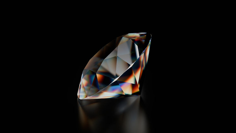 A diamond on a black background with reflection