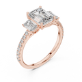 Rose gold emerald cut three stone lab grown diamond ring, side view