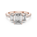 Rose gold emerald cut three stone lab grown diamond ring, angled view