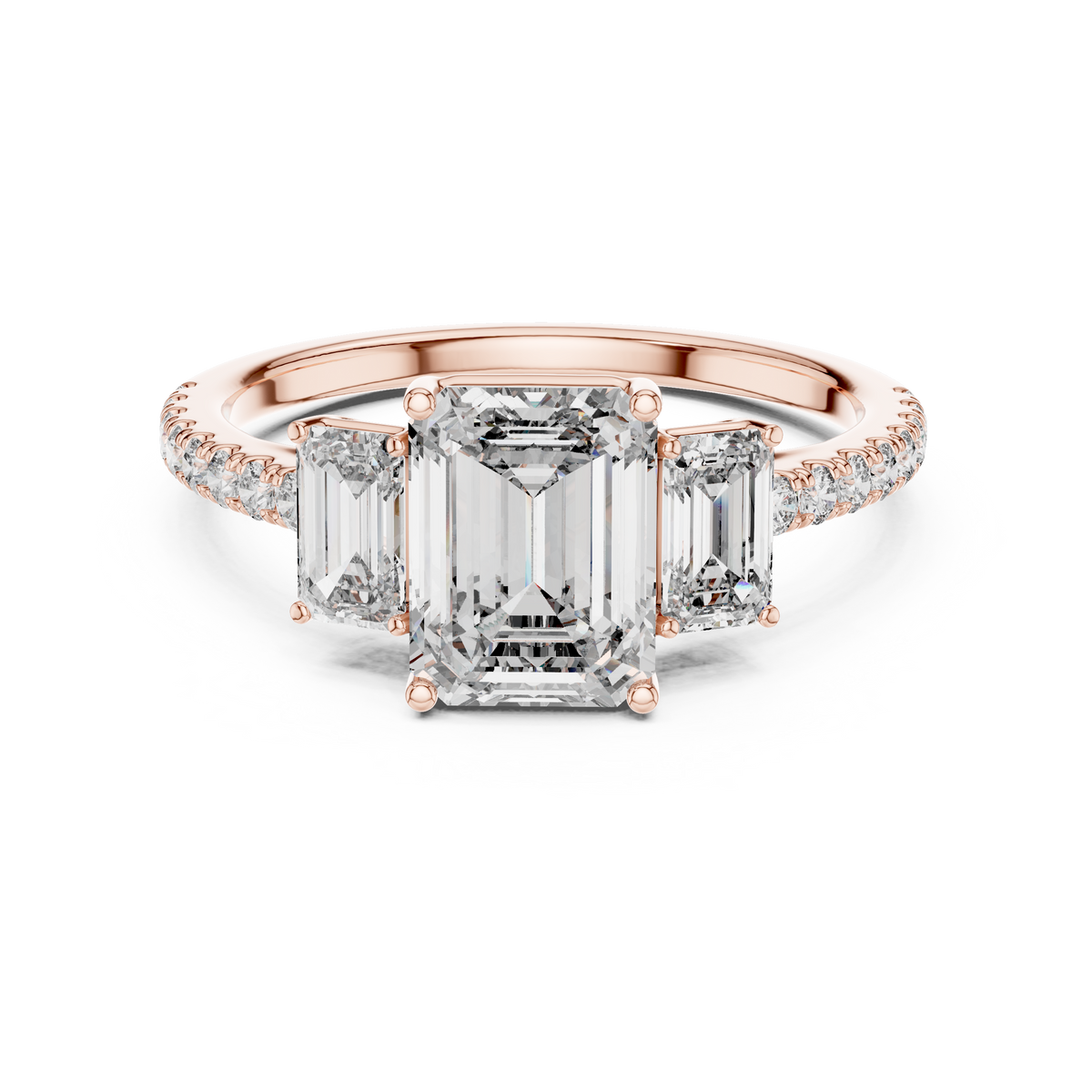 Rose gold emerald cut three stone lab grown diamond ring, angled view