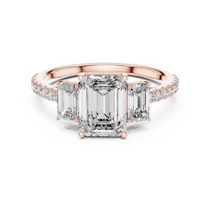 Rose gold emerald cut three stone lab grown diamond ring, angled view