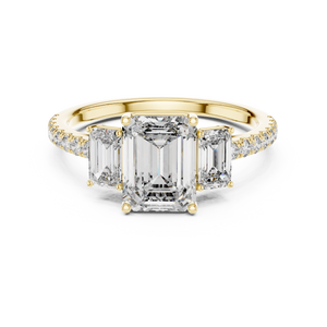 Yellow gold emerald cut three stone lab grown diamond ring, angled view