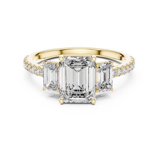 Yellow gold emerald cut three stone lab grown diamond ring, angled view