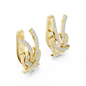 Yellow gold lab grown diamond love knot huggie earrings, side view
