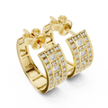 Yellow gold pavé lab grown diamond huggie hoop earrings, angled side view