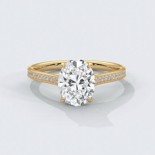 Gold ring with a large diamond and smaller diamonds on the band against a white background
