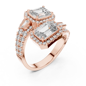 Rose gold lab grown diamond emerald cut toi et moi engagement ring, angled view