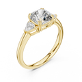 Yellow gold lab grown diamond cushion cut three stone engagement ring, angled view