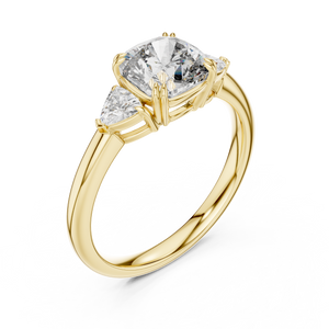 Yellow gold lab grown diamond cushion cut three stone engagement ring, angled view