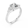 White gold lab grown diamond cushion cut three stone engagement ring, angled view