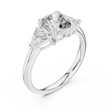 White gold lab grown diamond cushion cut three stone engagement ring, angled view
