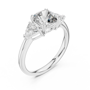 White gold lab grown diamond cushion cut three stone engagement ring, angled view