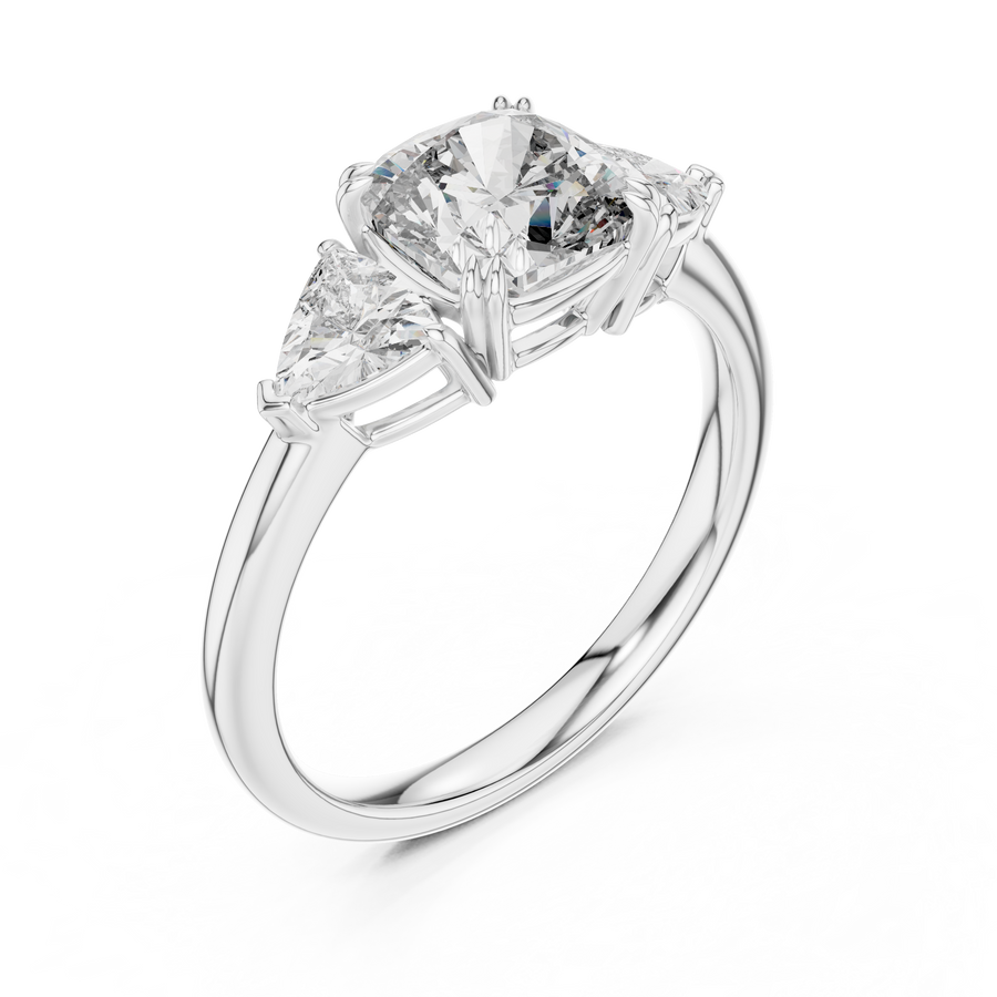 White gold lab grown diamond cushion cut three stone engagement ring, angled view