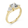 Yellow gold lab grown diamond cushion cut three stone engagement ring, angled view