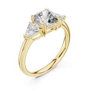 Yellow gold lab grown diamond cushion cut three stone engagement ring, angled view