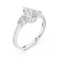 White gold lab grown diamond pear cut three stone engagement ring, angled view