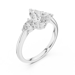 White gold lab grown diamond pear cut three stone engagement ring, angled view
