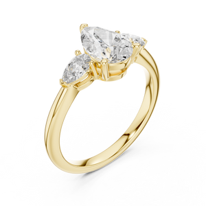 Yellow gold lab grown diamond pear cut three stone engagement ring, angled view