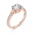 Rose gold lab grown diamond round cut three stone engagement ring, angled view