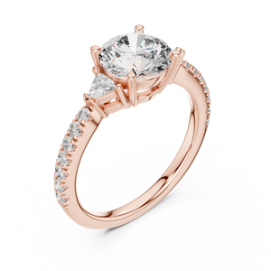 Rose gold lab grown diamond round cut three stone engagement ring, angled view