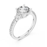 White gold lab grown diamond round cut three stone engagement ring, angled view