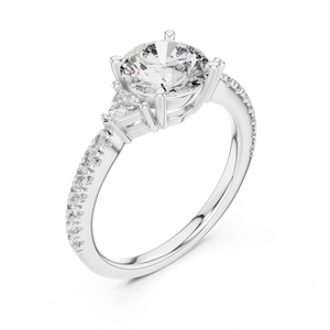 White gold lab grown diamond round cut three stone engagement ring, angled view
