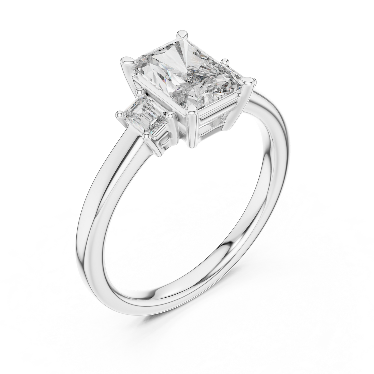 White gold lab grown diamond radiant cut three stone engagement ring, angled view