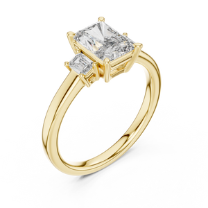 Yellow gold lab grown diamond radiant cut three stone engagement ring, angled view