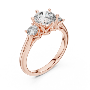 Rose gold lab grown diamond round cut three stone engagement ring, angled view