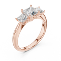 Rose gold lab grown diamond princess cut three stone engagement ring, angled view