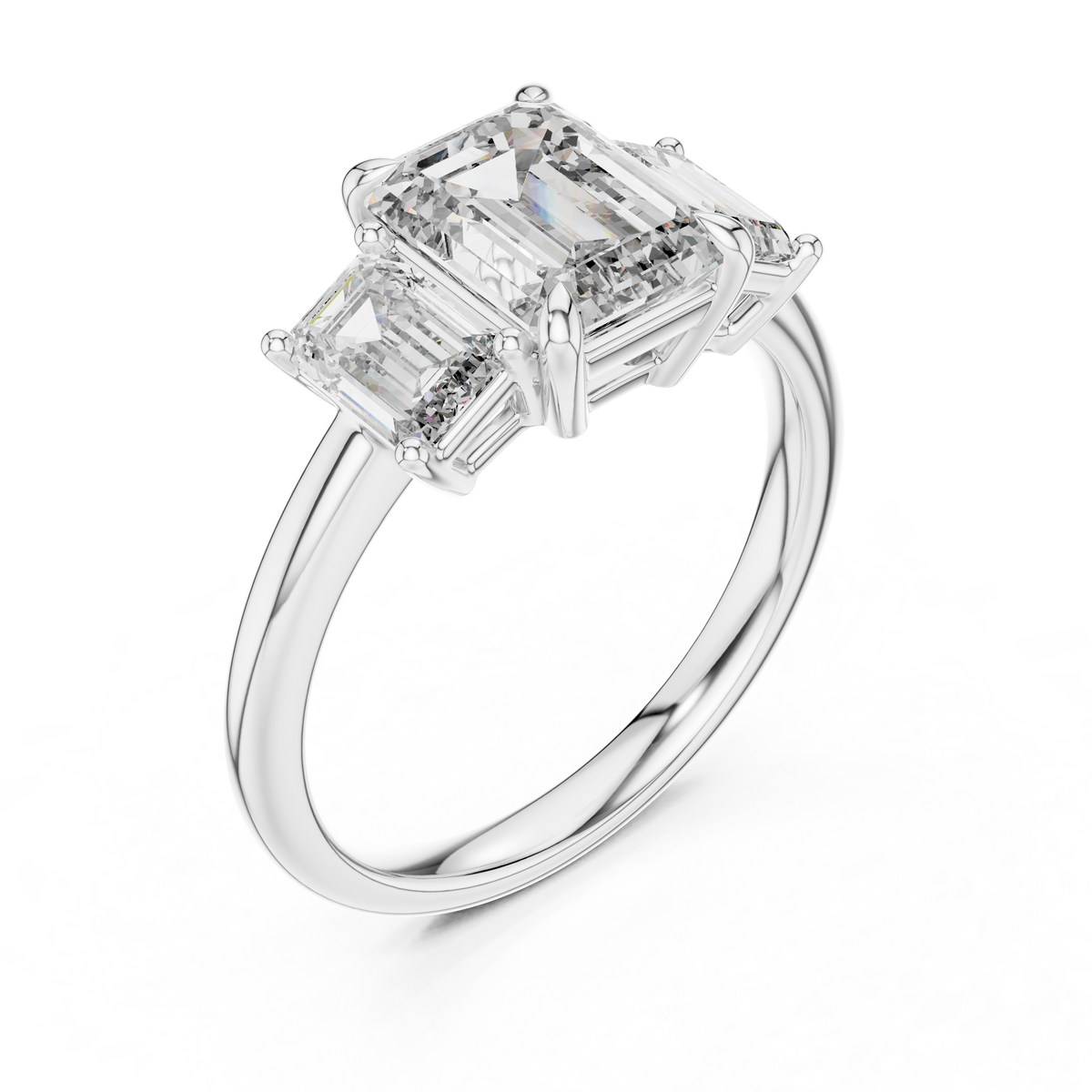 White gold lab grown diamond emerald cut three stone engagement ring, angled view