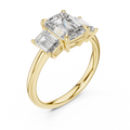 Yellow gold lab grown diamond emerald cut three stone engagement ring, angled view