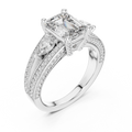 White gold lab grown diamond emerald and pear three stone engagement ring, angled view