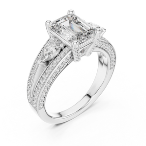 White gold lab grown diamond emerald and pear three stone engagement ring, angled view