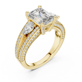 Yellow gold lab grown diamond emerald and pear three stone engagement ring, angled view