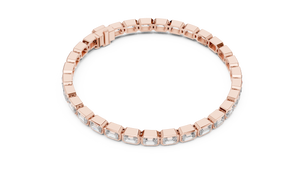 Rose gold emerald cut bezel set diamond tennis bracelet, angled view