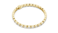 Yellow gold emerald cut bezel set diamond tennis bracelet, angled view