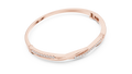 Rose gold 0.70 ct twisted diamond bangle bracelet, angled view