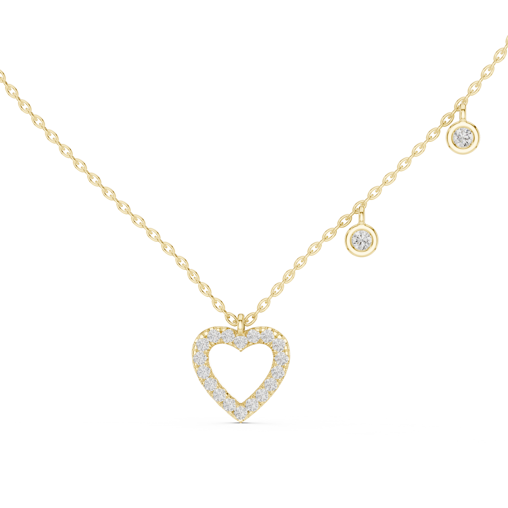 "yellow gold heart-shaped diamond pendant necklace with dangling diamond accents"