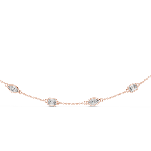 Rose gold lab grown diamond station necklace, close-up of bezel-set diamonds
