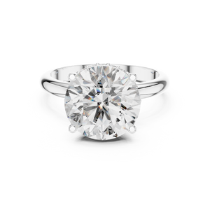 Front view of a round brilliant cut diamond solitaire engagement ring in white gold or platinum with a transparent background.