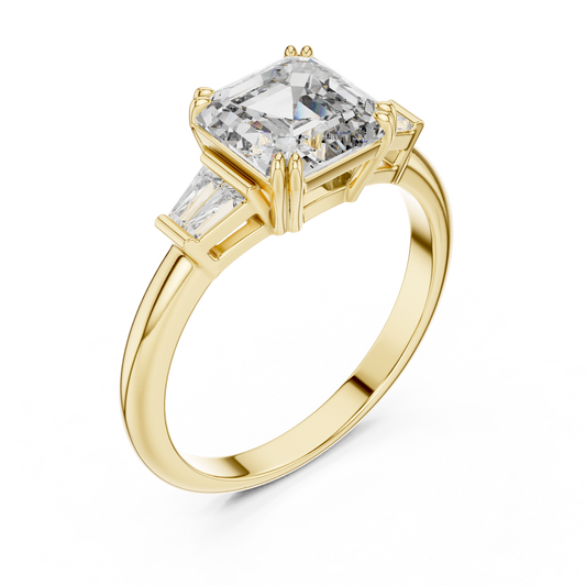 Emerald cut lab grown diamond three stone ring with baguette side stones in yellow gold, front view