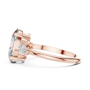 3.10 CTW oval cut three stone lab grown diamond engagement ring in rose gold, side view