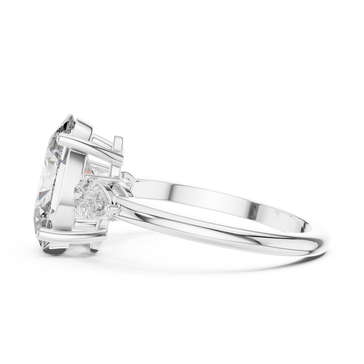 A side view of a luxury three-stone lab-grown diamond engagement ring in solid white gold, showcasing a 2.75 carat oval-cut center diamond and a brilliant pear-cut side stone on a clean background.