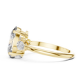 3.10 CTW oval cut three stone lab grown diamond engagement ring in yellow gold, side view