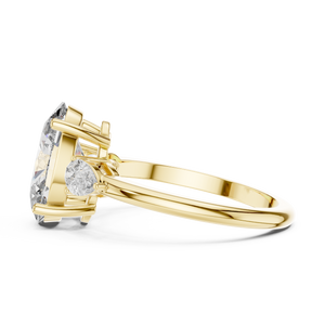3.10 CTW oval cut three stone lab grown diamond engagement ring in yellow gold, side view